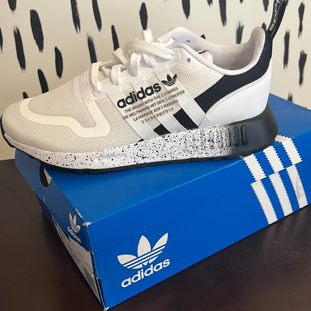 Adidas tennis shoes. Wore only once